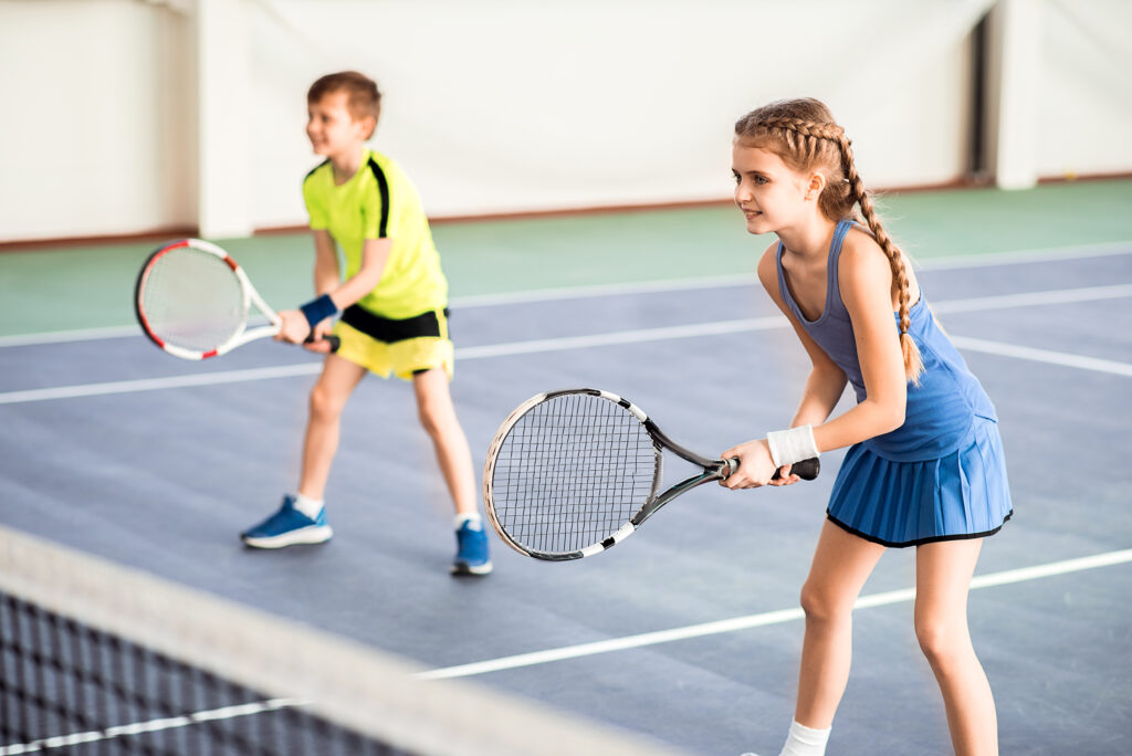 happy children playing sport game on court